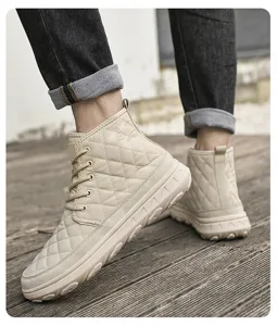 Close-up view of men's winter quilted high-top cotton boots in beige on wooden floor.