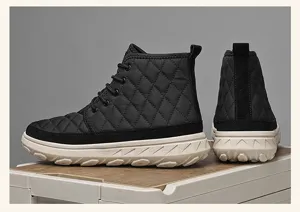 Detailed view of men's winter warm high-top snow boots, black quilted design with thick sole.