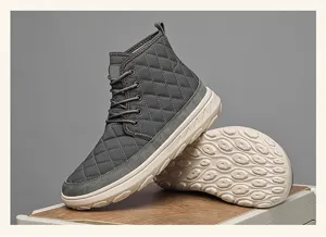 Grey quilted winter snow boots detail view, high top warm shoes with thick anti-slip sole.