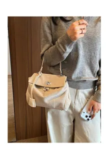 Detailed view of women's suede shoulder handbag, casual tote briefcase, stylish and practical.