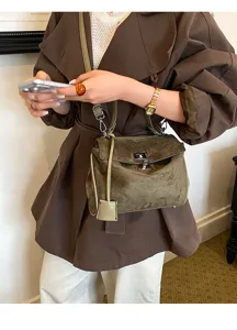 Retro suede shoulder crossbody bag for women, elegant olive green top handle handbag detail.