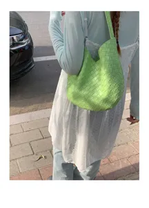 Green woven shoulder bag for women, stylish large capacity underarm bag for daily commuting style.