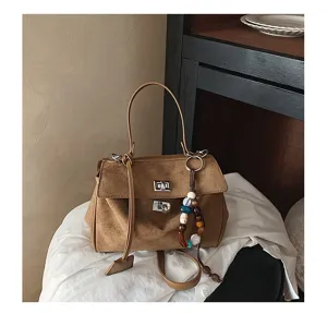 Minimalist suede handbag for women, large capacity shoulder bag with beaded charm.