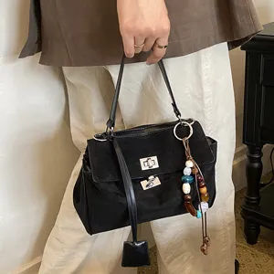 Black suede handbag for women, chic minimalist top handle shoulder bag with metal lock.