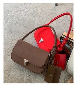Minimalist nylon underarm shoulder bag for women, versatile daily handbag with coin purse.