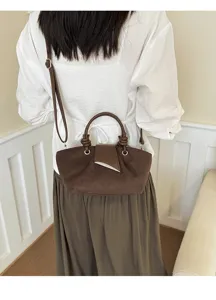 Brown suede handbag for women, chic retro shoulder bag and crossbody tote with metal accent.