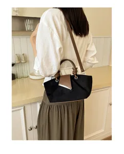 Vintage suede shoulder bag for women, stylish brown handle design, casual daily crossbody bag.