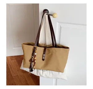 Vintage large capacity canvas tote bag for women stylish shoulder bag with tassel charm
