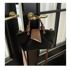Retro suede handbag for women, minimalist black and brown crossbody tote bag detail view.