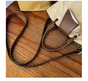 Vintage suede tote bag for women, retro brown shoulder crossbody handbag with chic details.