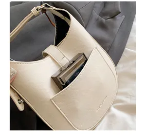 Minimalist white hobo saddle shoulder bag detail, chic PU leather purse with front pocket design.