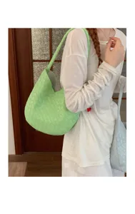 Green woven shoulder bag for women, stylish large capacity underarm bag for daily commute.