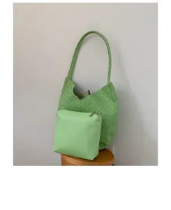 Summer large capacity woven shoulder underarm bag with small pouch for women daily commute.