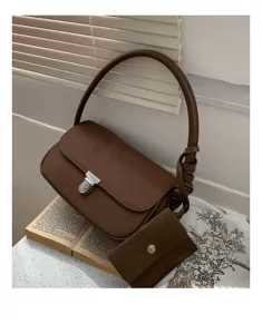 Minimalist brown underarm shoulder bag with metal lock and coin purse detail, chic and versatile.