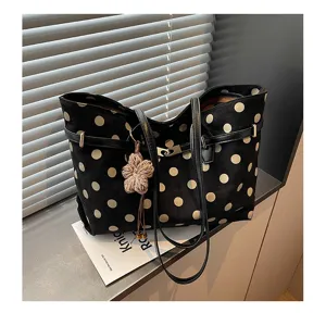Detail view of the retro polka dot suede tote bag, large capacity autumn winter shoulder bag.