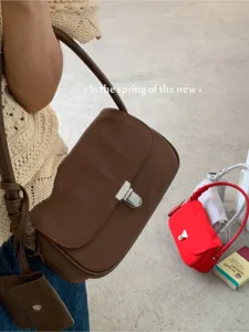 Minimalist brown nylon shoulder bag for women, chic vintage underarm handbag with metal lock.