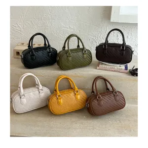 Chic woven top handle handbag retro shoulder crossbody bag for women stylish daily accessory.