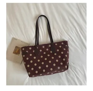 Retro polka dot suede tote bag detail, featuring spacious interior and double shoulder handles.