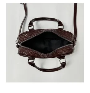 Retro woven leather handbag for women, elegant top handle crossbody bag with zipper closure.