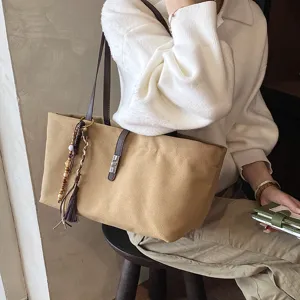 Vintage large canvas tote bag for women, casual shoulder bag with tassel charm and lock.