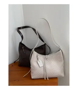 Woven hobo shoulder bag for women, vintage niche design PU leather retro underarm purse.