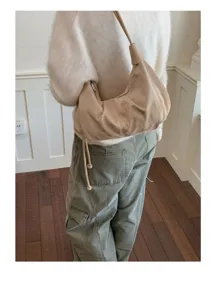 Retro suede underarm bag detail, minimalist shoulder dumpling bag for women autumn winter.