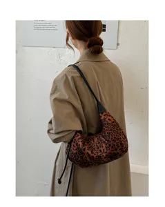 Leopard print suede hobo bag detail shot, vintage underarm shoulder bag with black strap