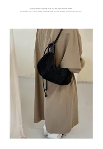 Black suede dumpling underarm bag for women, minimalist single shoulder crossbody bag.