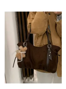 Brown suede tote bag with cute bear pendant, stylish shoulder bag for autumn and winter daily commute.