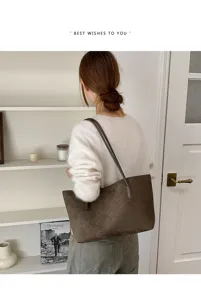 Vintage suede shoulder bag for women, large capacity minimalist tote and hobo purse style.