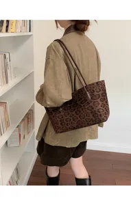 Vintage retro leopard print suede underarm shoulder handbag detail view showing bag style.