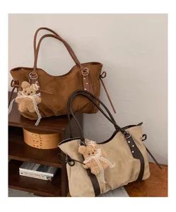 Detailed view of autumn winter suede tote bag with cute bear charm and large capacity.