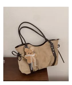 Large capacity brown suede shoulder bag with cute bear charm and classic leather strap details.