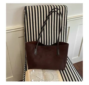Minimalist brown suede shoulder bag for women, retro large capacity casual tote bag style.