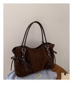 Brown suede tote bag detail, large capacity shoulder bag with double straps and ring decor.