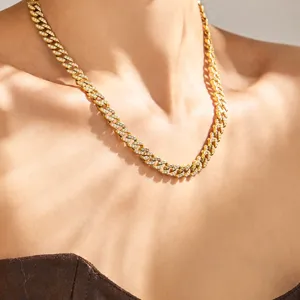 Close-up detail shot of the gold-plated paved zircon Cuban link necklace showing fine texture.