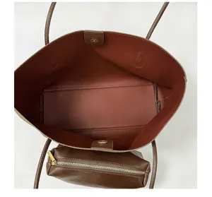 Detailed top-down view of a spacious brown tote bag with inner lining and matching pouch.