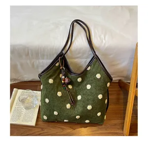 Retro green plush polka dot suede shoulder tote bag detail showcasing chic texture and vintage charm.
