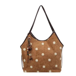 Stylish brown suede shoulder bag with cute white fluffy polka dots and decorative beads.