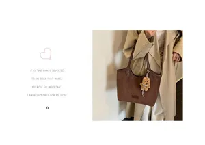 Retro suede tote bag detail, minimalist brown shoulder bag with cute bear pendant.