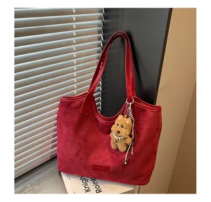 Red suede tote bag for women, large capacity retro shoulder bag with cute puppy charm.