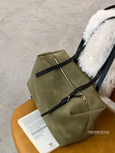 Vintage olive green suede tote bag, stylish pillow shoulder bag with black straps.