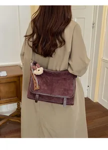 Retro suede underarm shoulder bag for women, casual crossbody bag with cute bear charm.