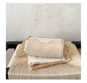 Retro woven cylinder shoulder bag for women, stylish diagonal crossbody pillow purse with gold hardware.