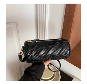 Black woven cylinder shoulder bag detail, stylish pillow crossbody purse with metal hardware.