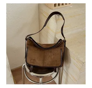 Brown suede shoulder bag for women, retro casual underarm tote bag with chic leather trim style.