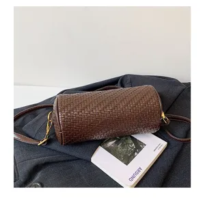 Retro woven cylinder crossbody bag for women, stylish brown barrel shoulder handbag design.