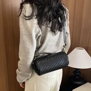 Womens black woven cylinder shoulder bag, stylish retro pillow crossbody bag for daily wear.