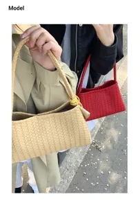 Woven shoulder bag for women, stylish leather underarm bag, trendy casual daily commuter handbag.