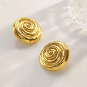 Gold-plated stainless steel spiral geometric earrings, chic minimalist detail view.